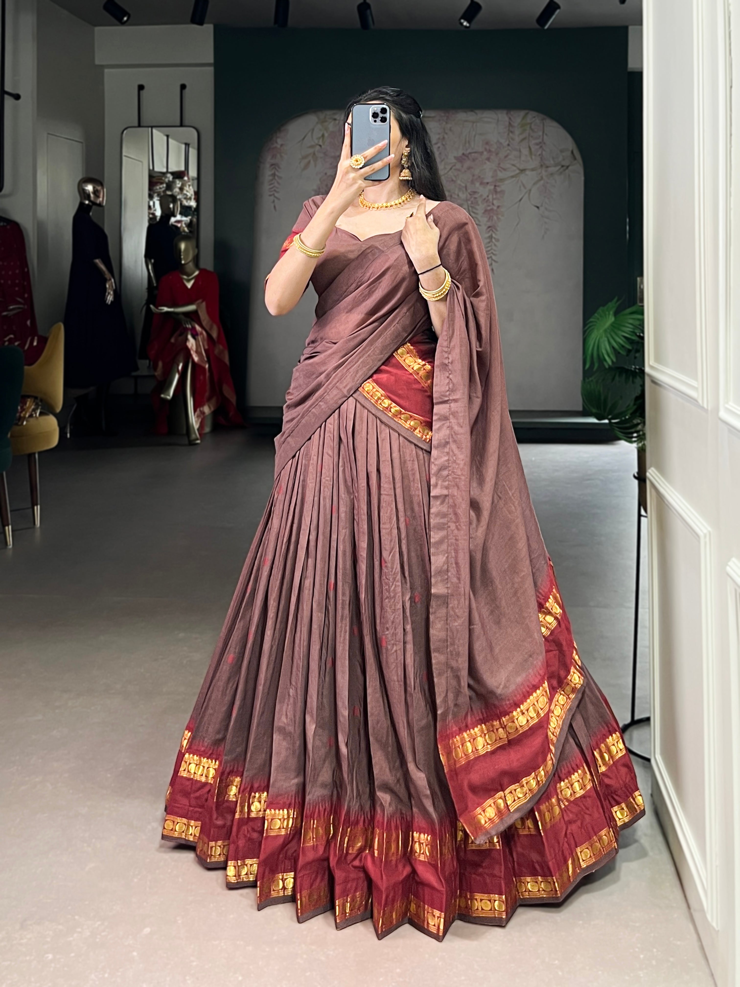 Classic maroon lehenga with a traditional green border