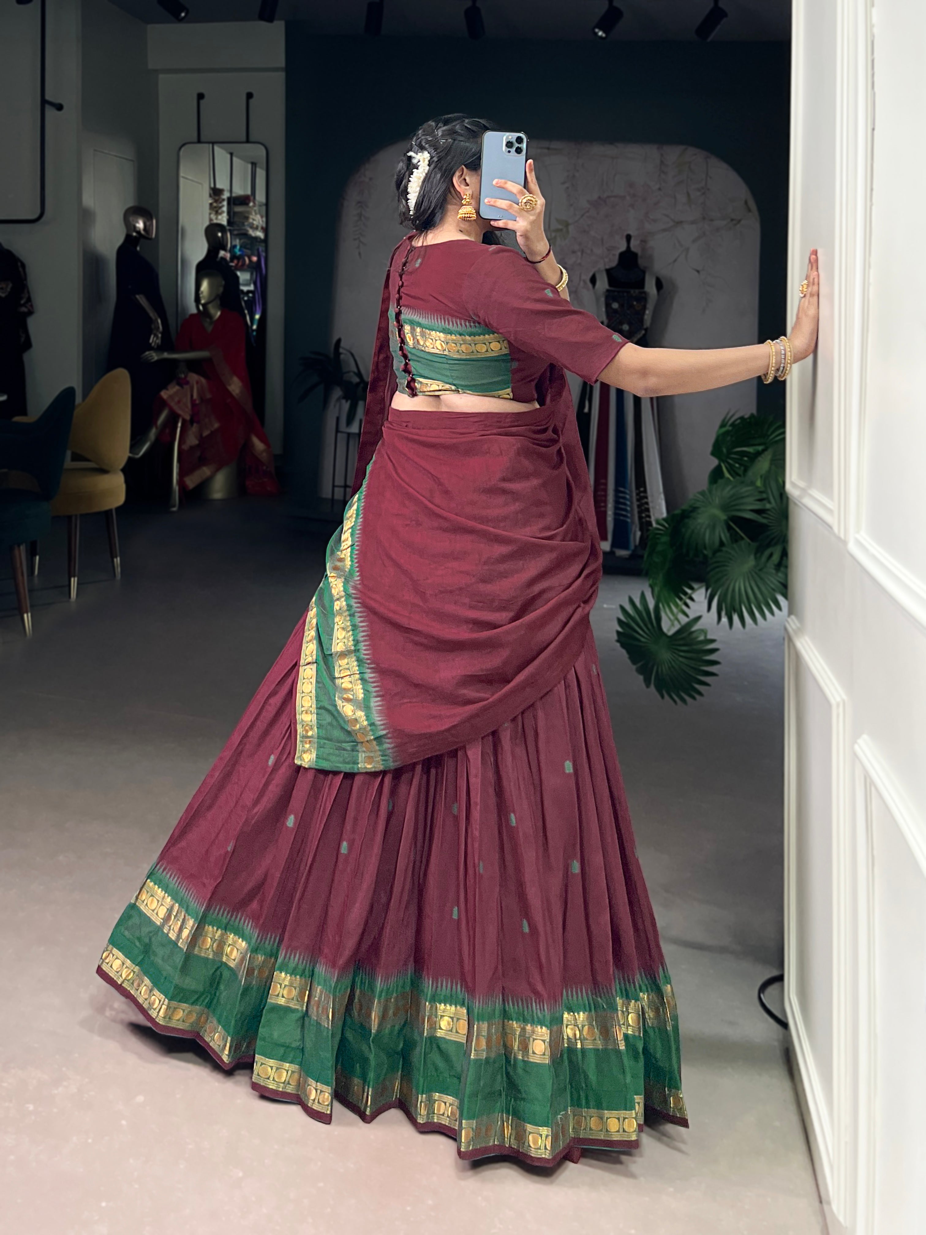 Classic maroon lehenga with a traditional green border