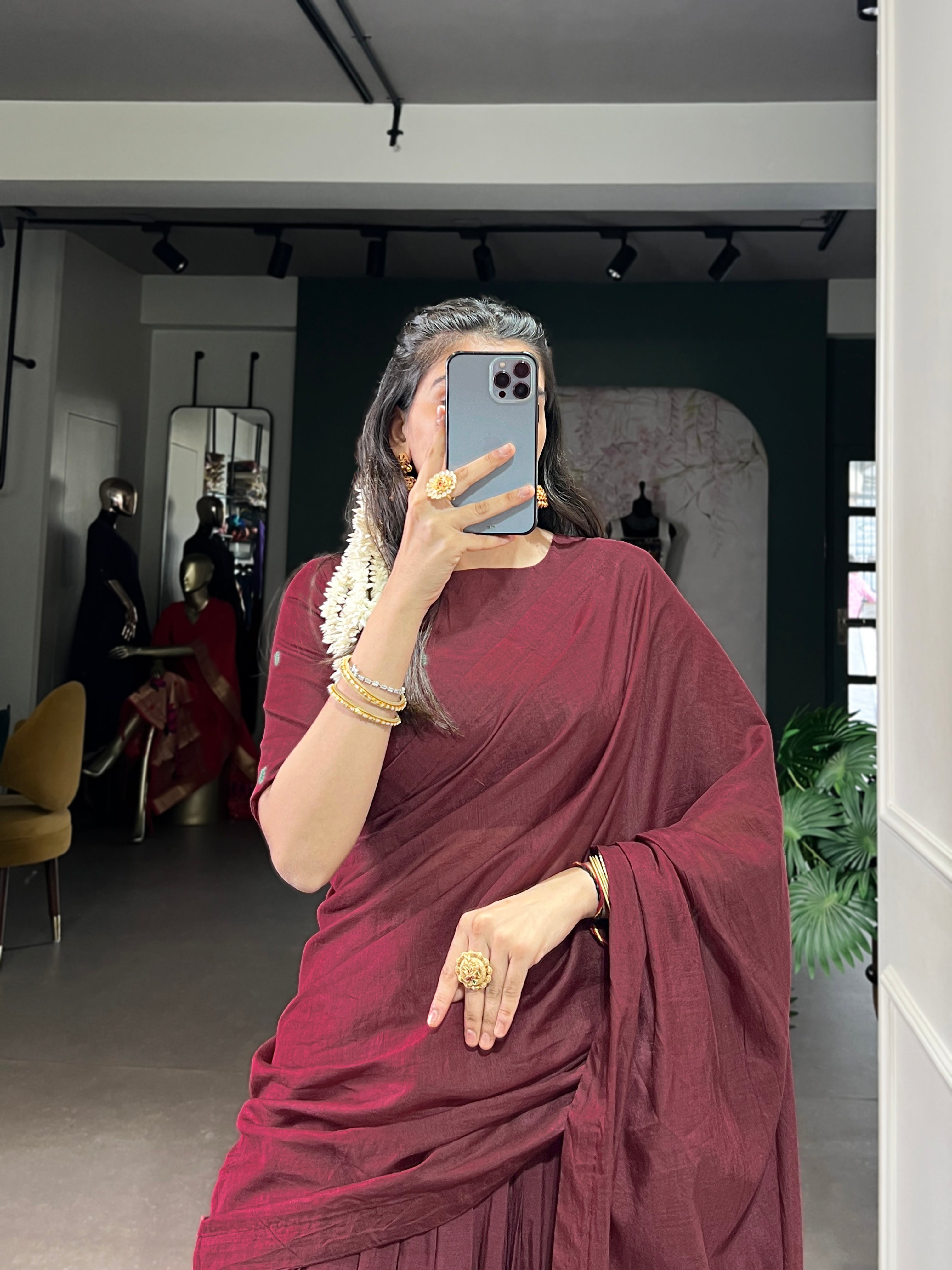 Classic maroon lehenga with a traditional green border