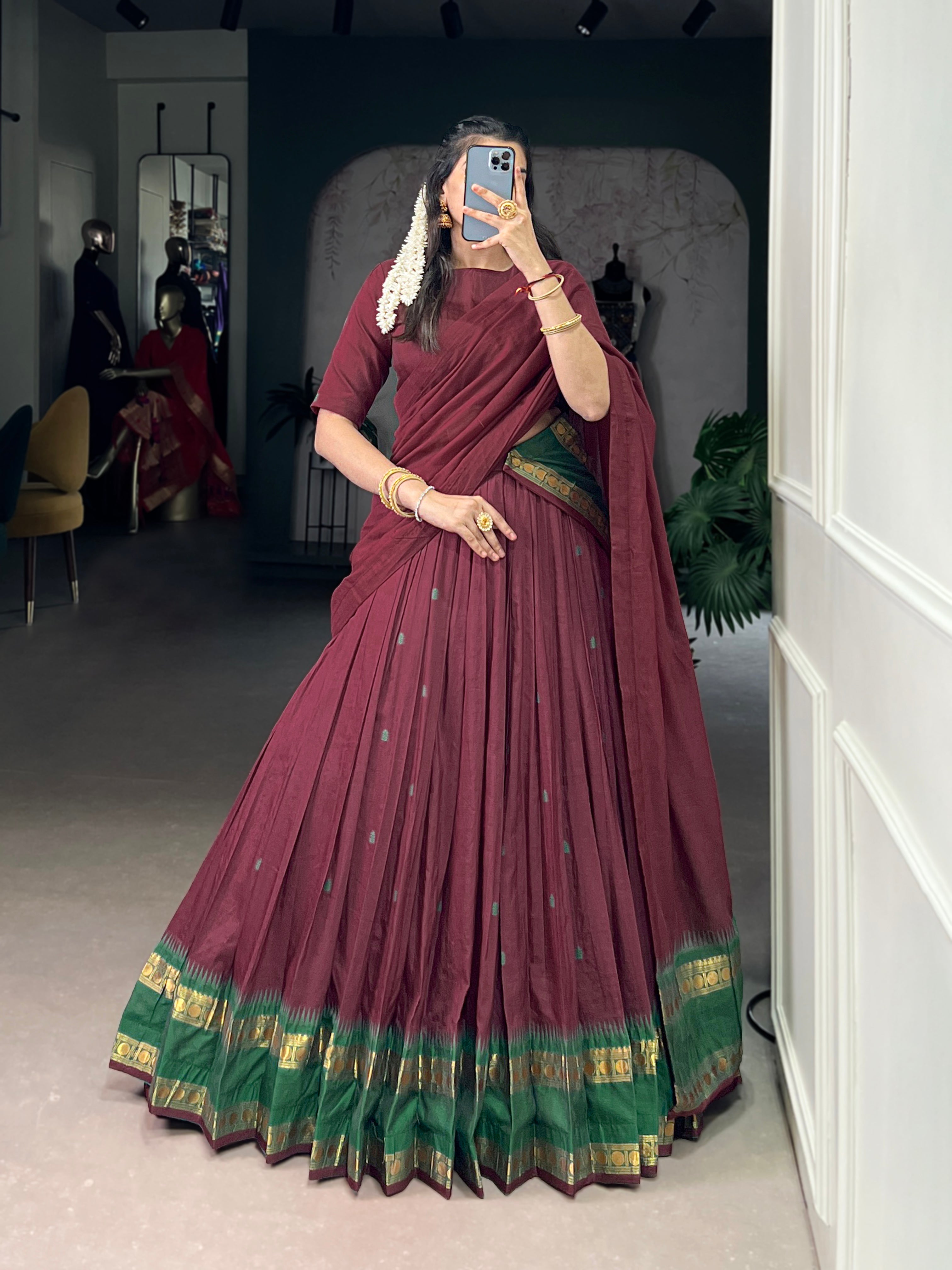 Classic maroon lehenga with a traditional green border
