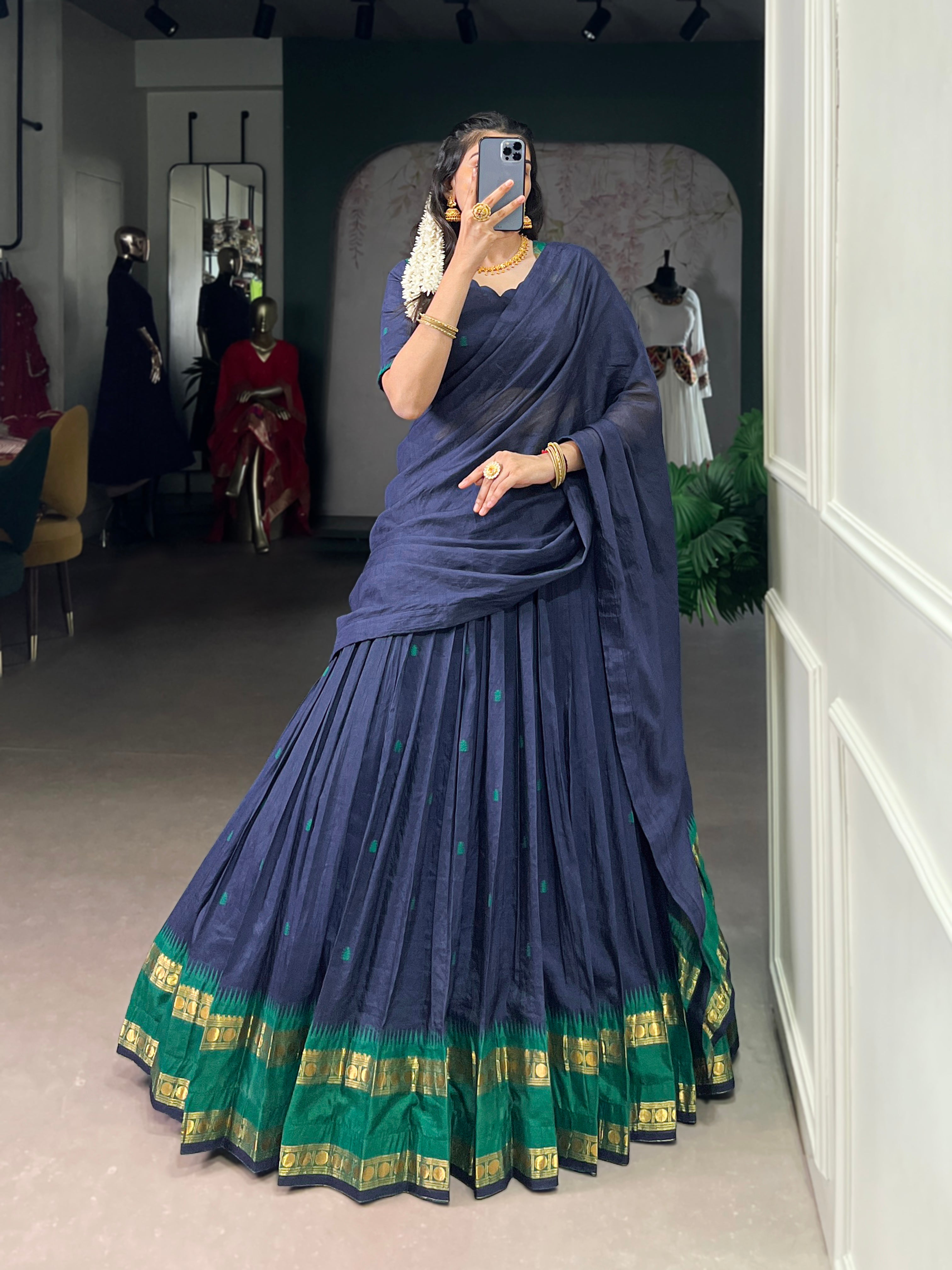 Classic maroon lehenga with a traditional green border