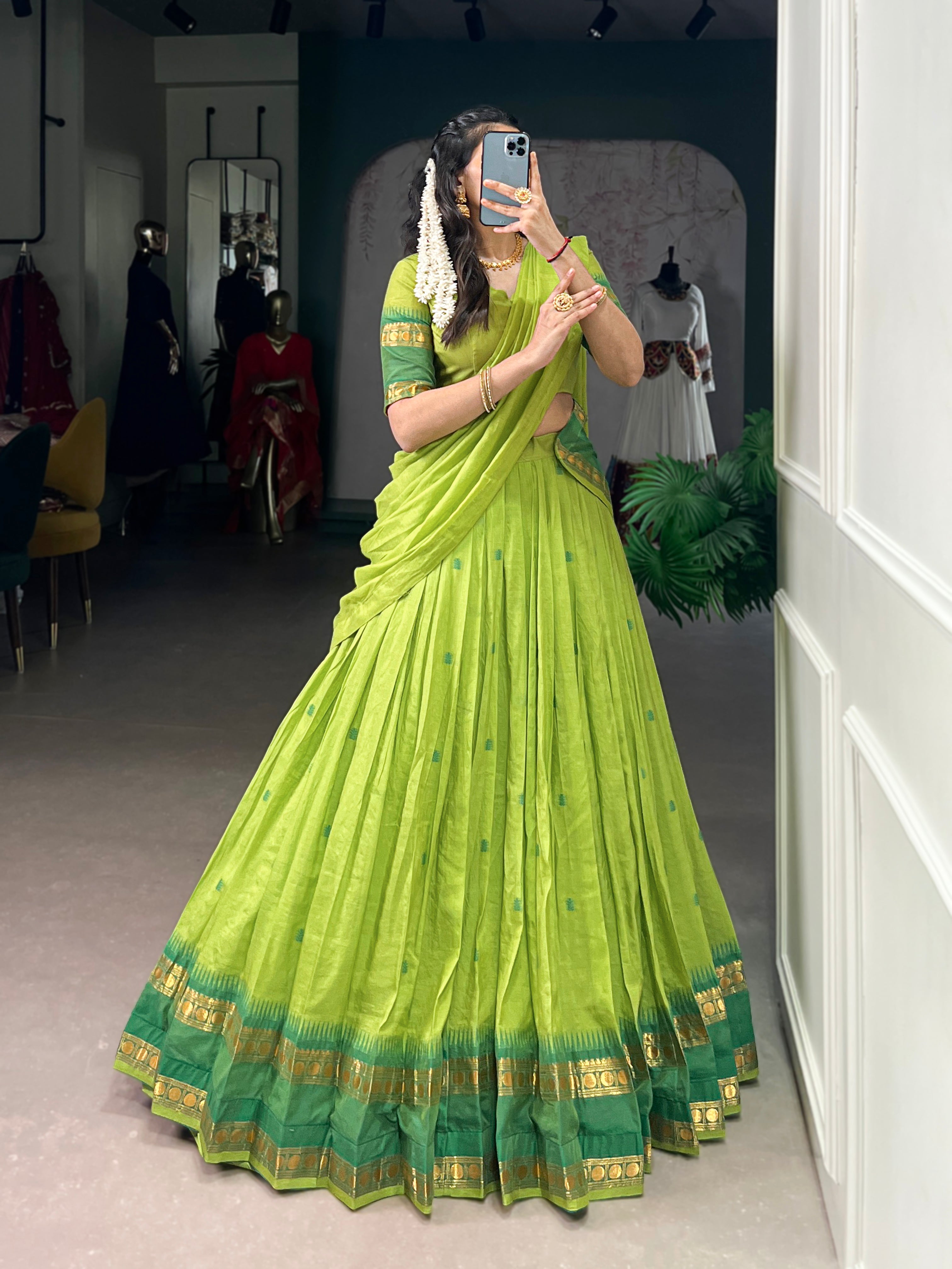 Classic maroon lehenga with a traditional green border