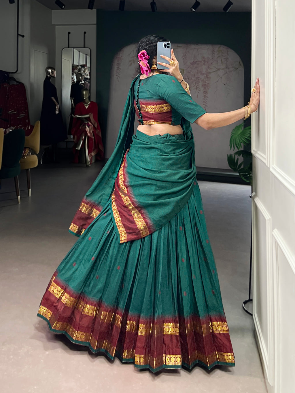 Classic maroon lehenga with a traditional green border