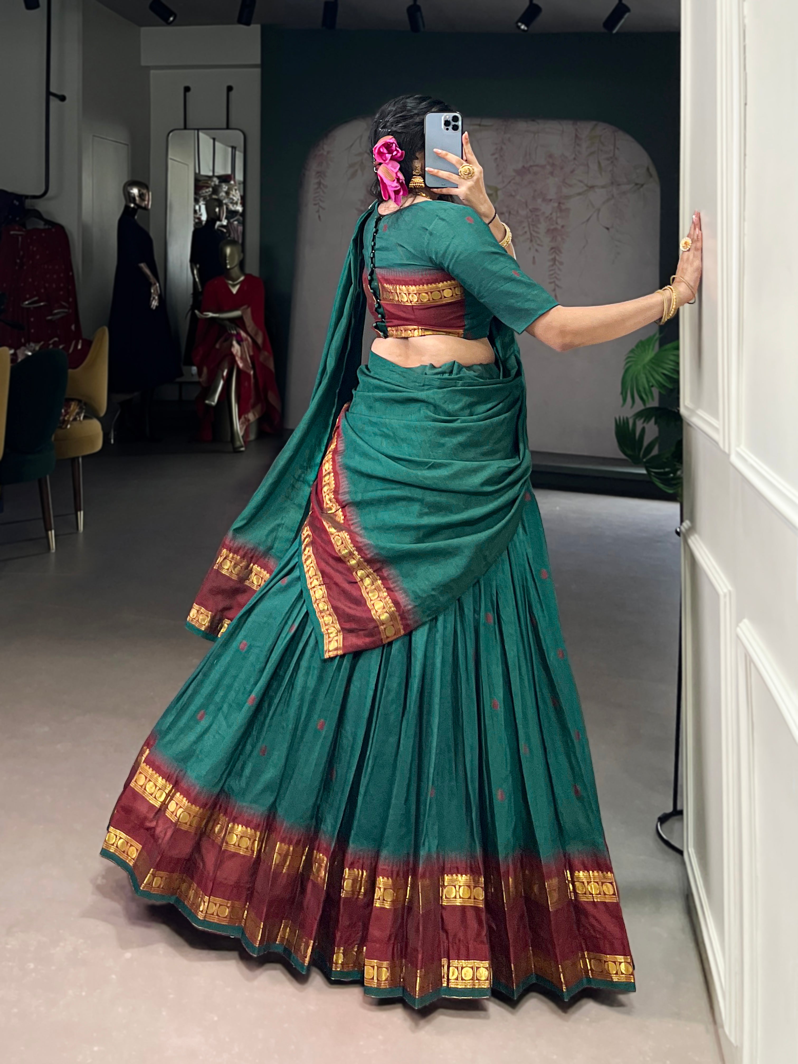 Classic maroon lehenga with a traditional green border