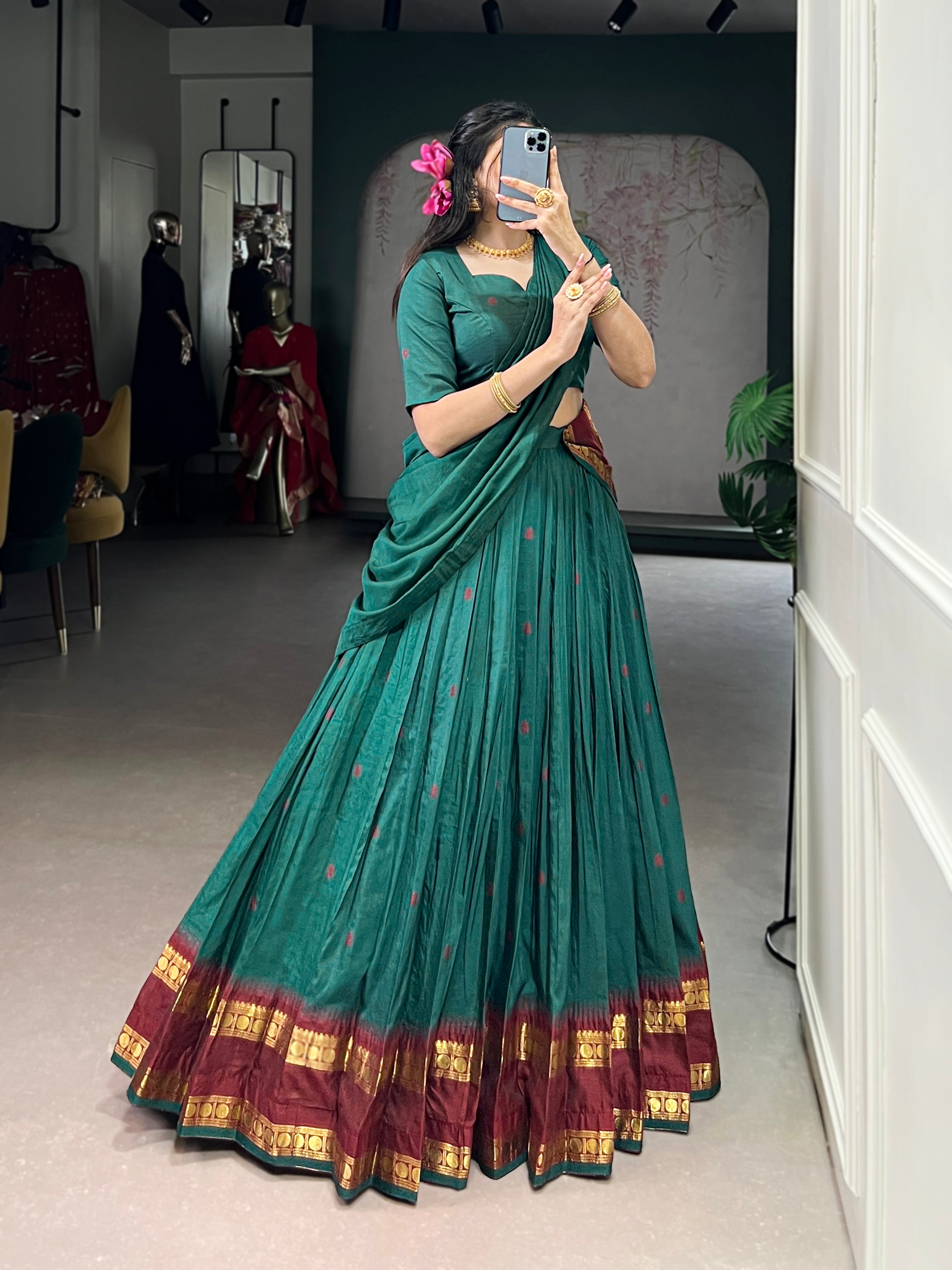 Classic maroon lehenga with a traditional green border