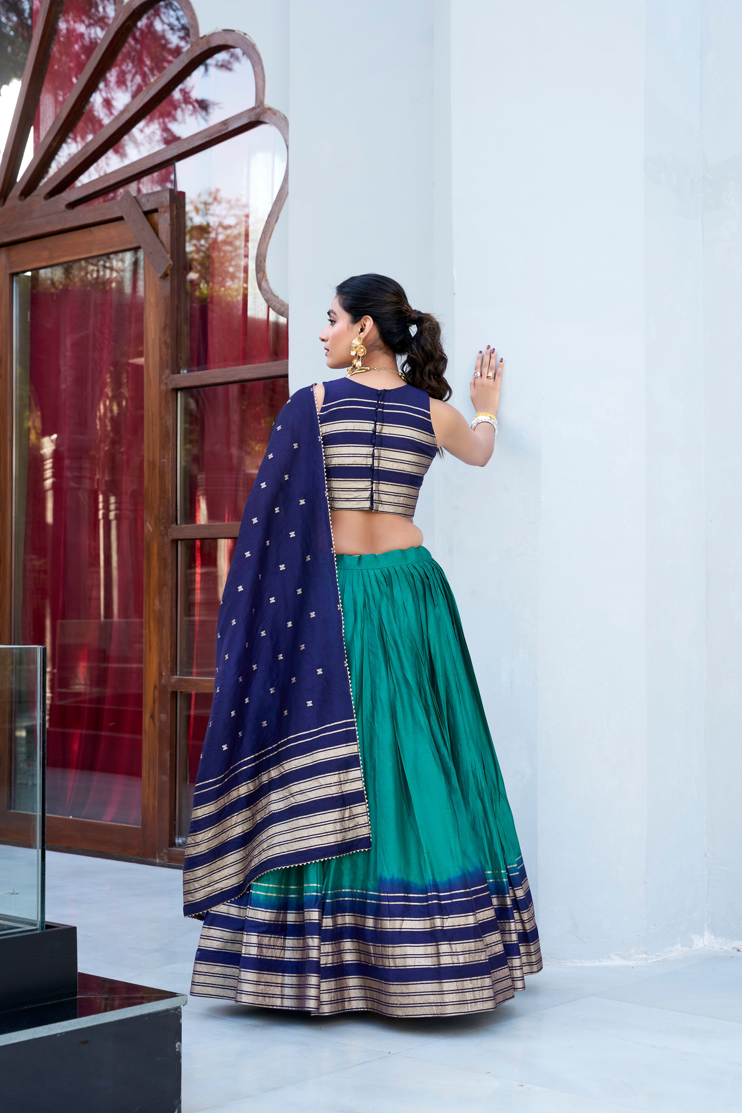 Regal sophistication in a stunning cream and purple lehenga.