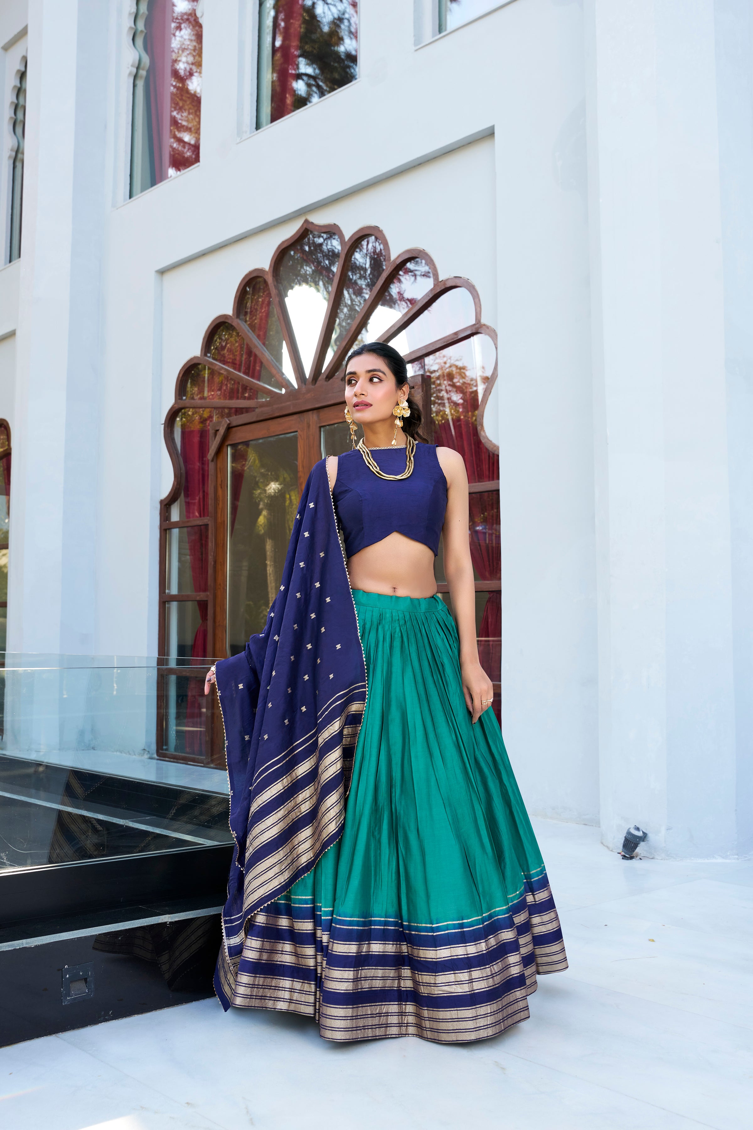 Regal sophistication in a stunning cream and purple lehenga.