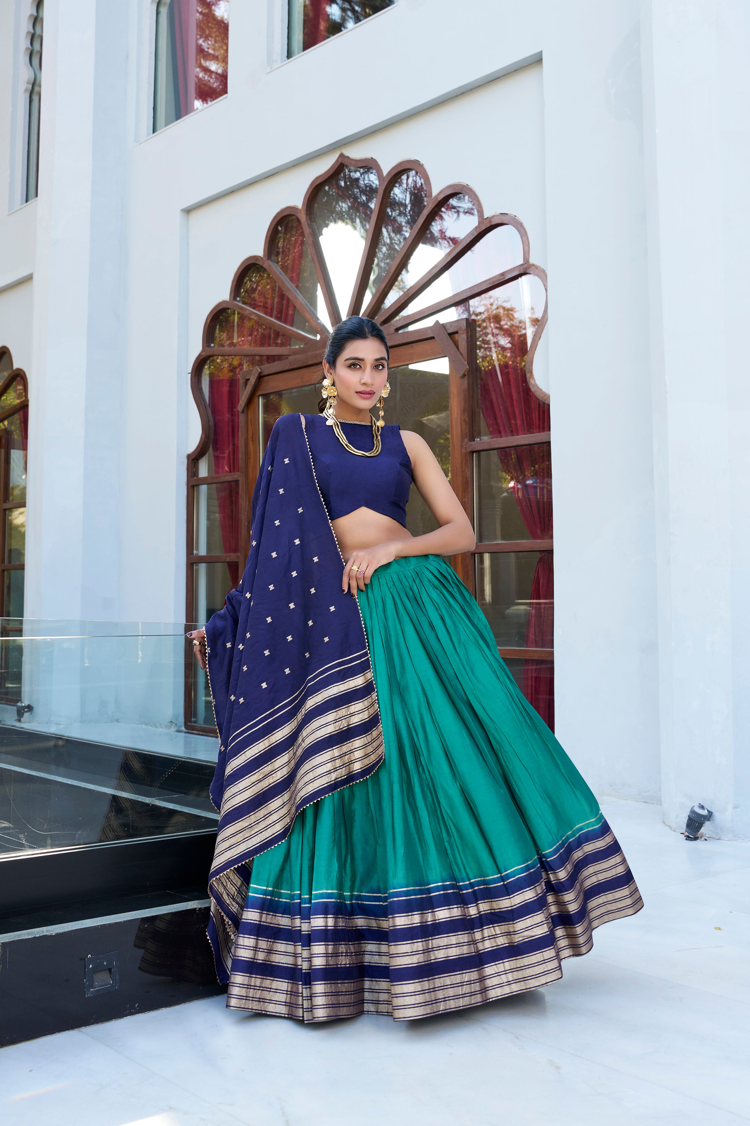 Regal sophistication in a stunning cream and purple lehenga.