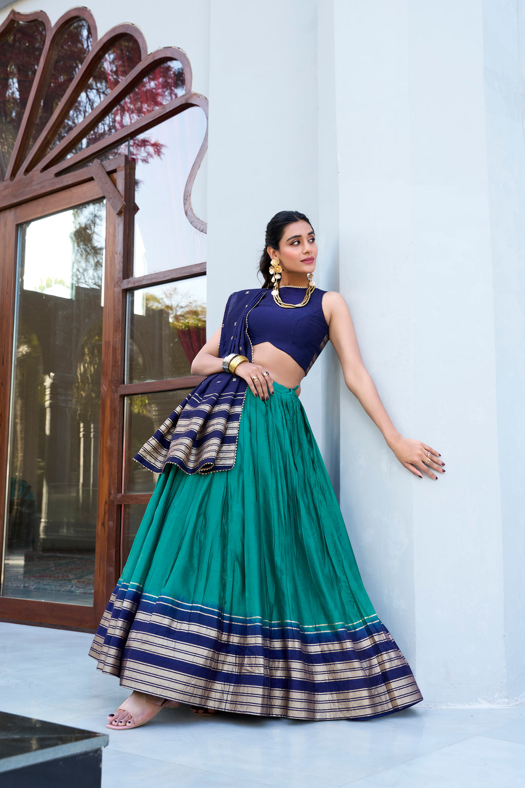 Regal sophistication in a stunning cream and purple lehenga.