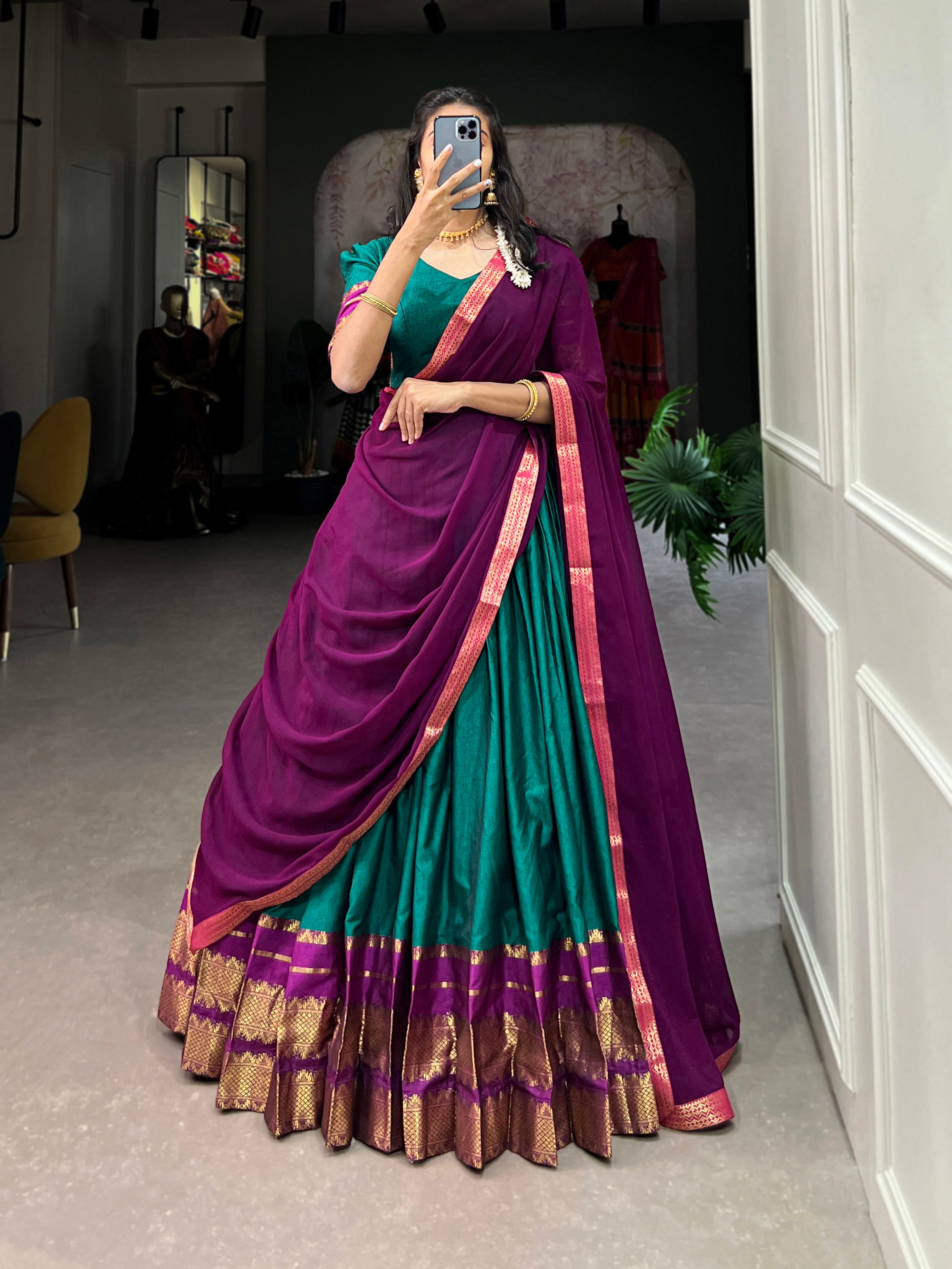 It's all in the details: the graceful drape, the grand border, and those classic sleeves