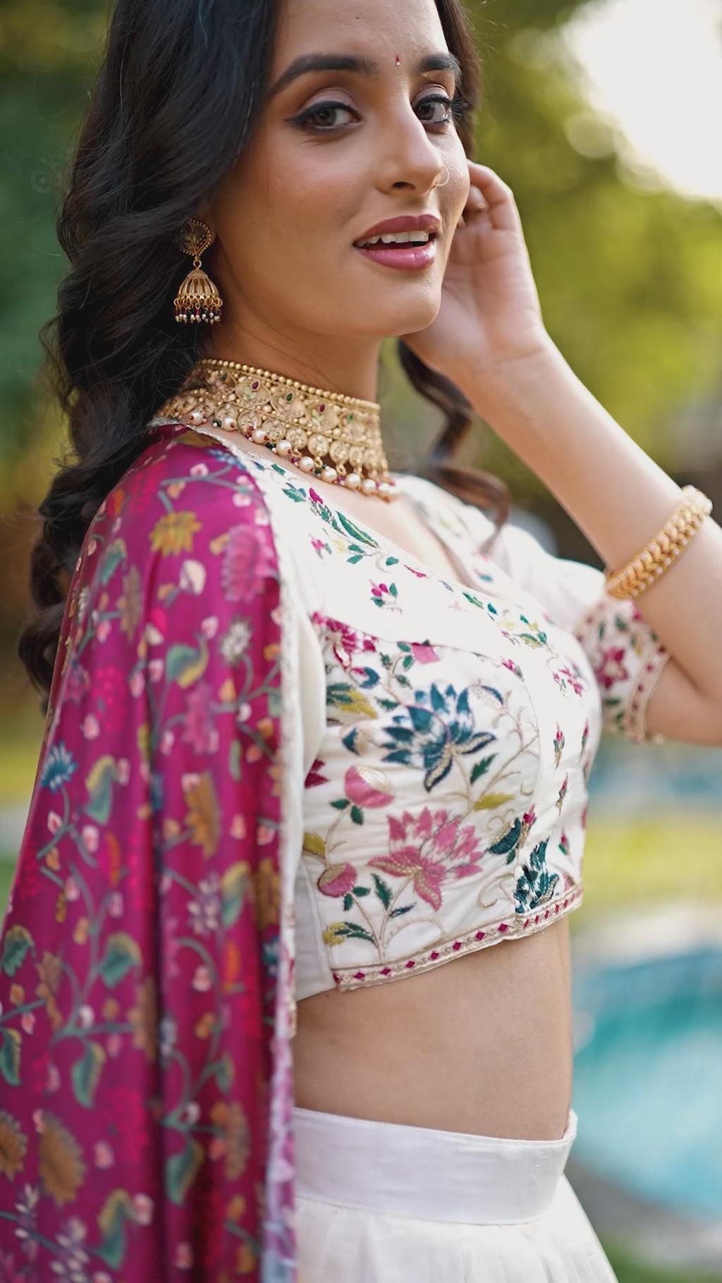 A vision of grace in an ivory lehenga adorned with peacock motifs.