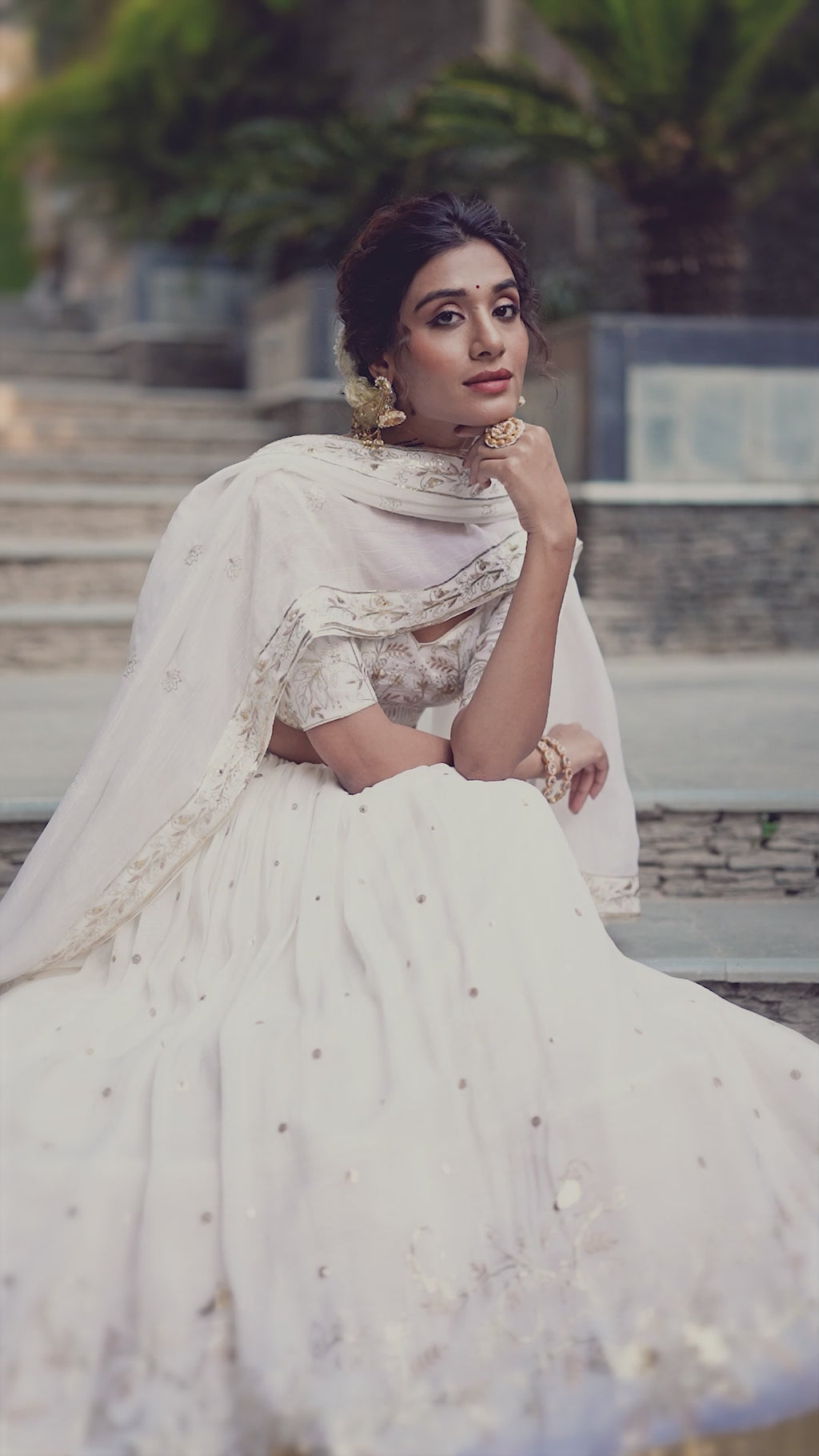 Graceful Off-White Lehenga Choli featuring Delicate Gold Floral Embroidery and a Broad Zari Border
