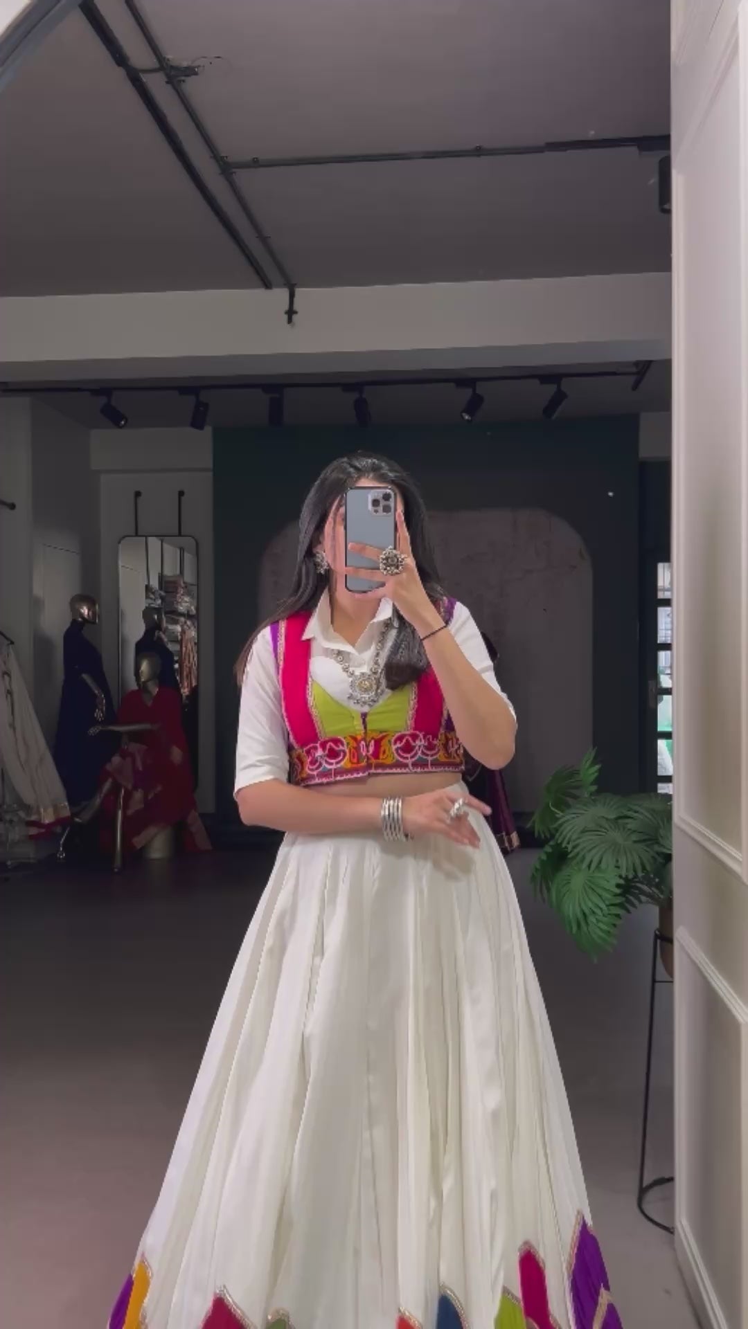 Designer White Lehenga Paired with Colorful Blouse and Border Detailing