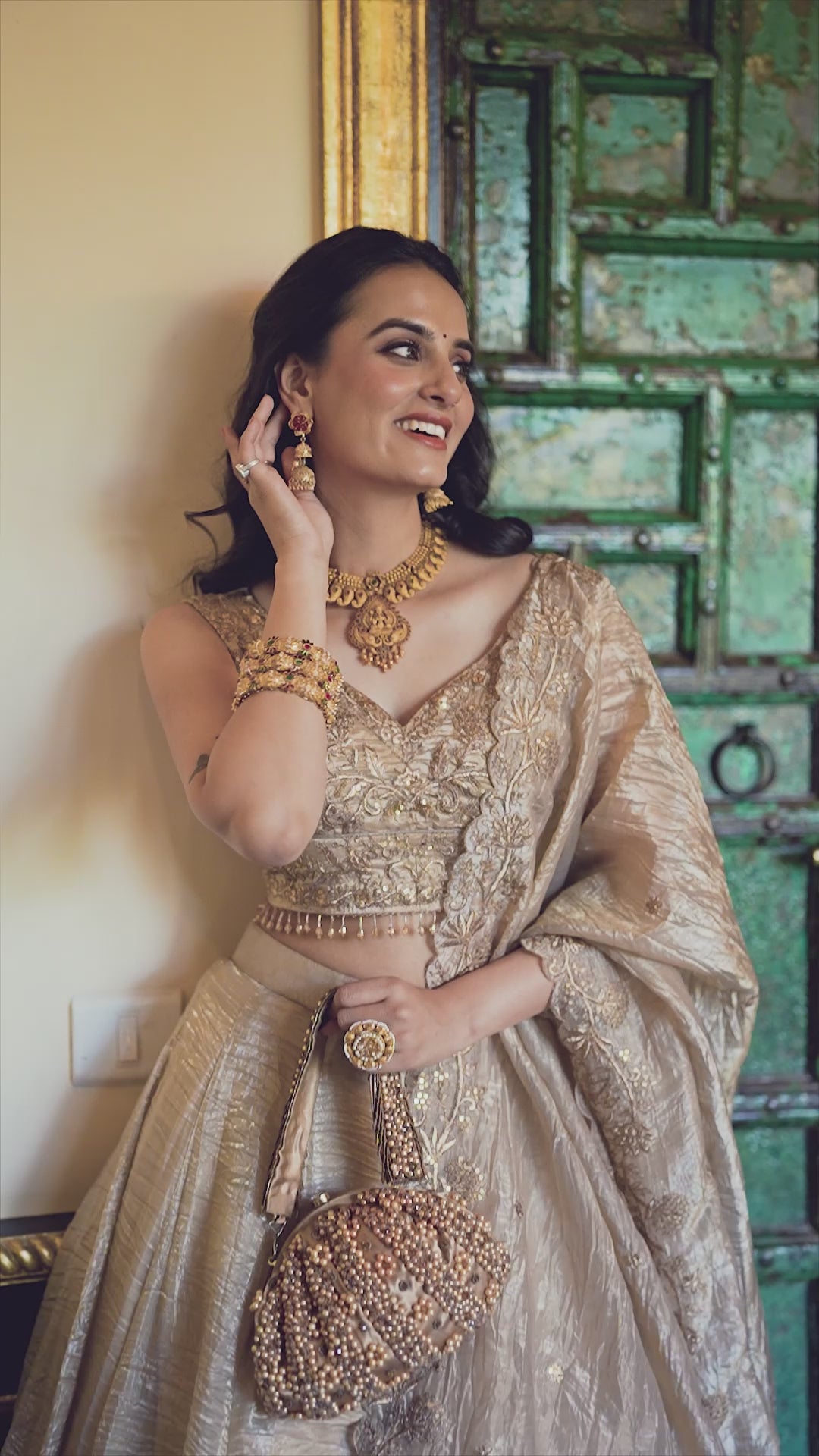 Regal radiance in a shimmering antique gold lehenga.