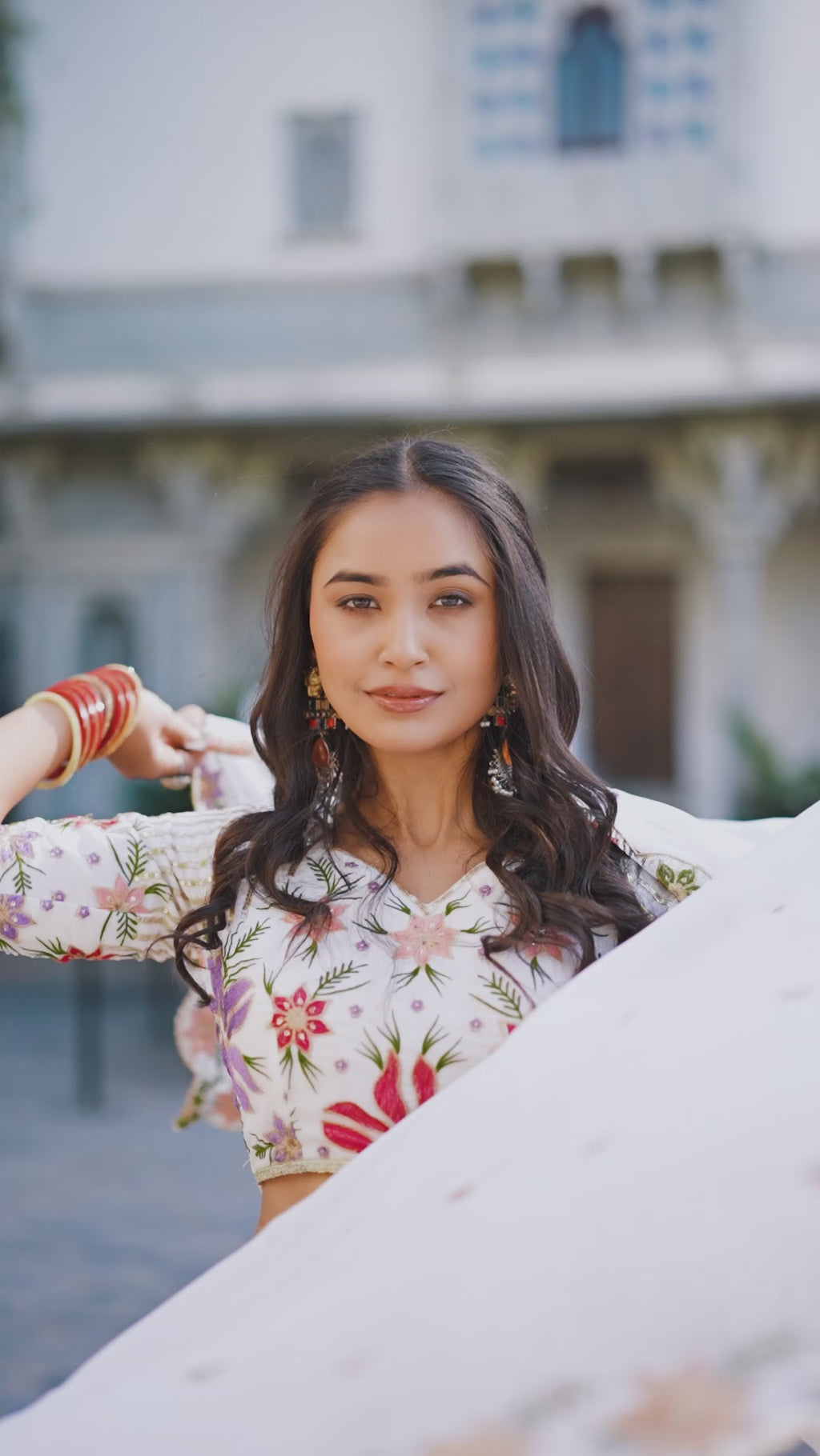 Serene White Lehenga with a Vibrant Floral Garden Print and Gold Border