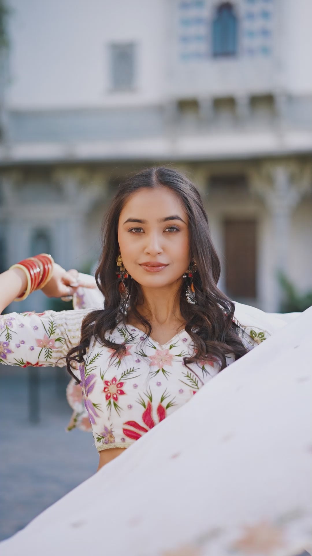 Serene White Lehenga with a Vibrant Floral Garden Print and Gold Border