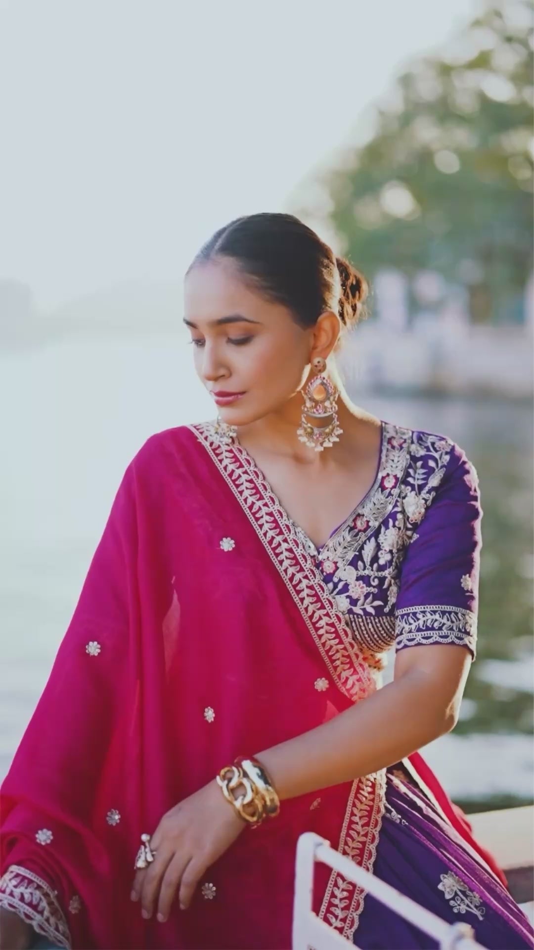 A vision of regal elegance in a vibrant purple and magenta lehenga.