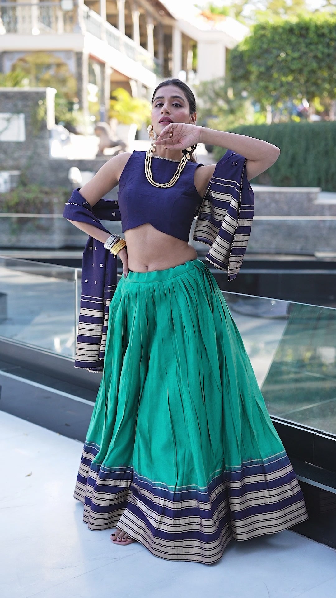 Regal sophistication in a stunning cream and purple lehenga.