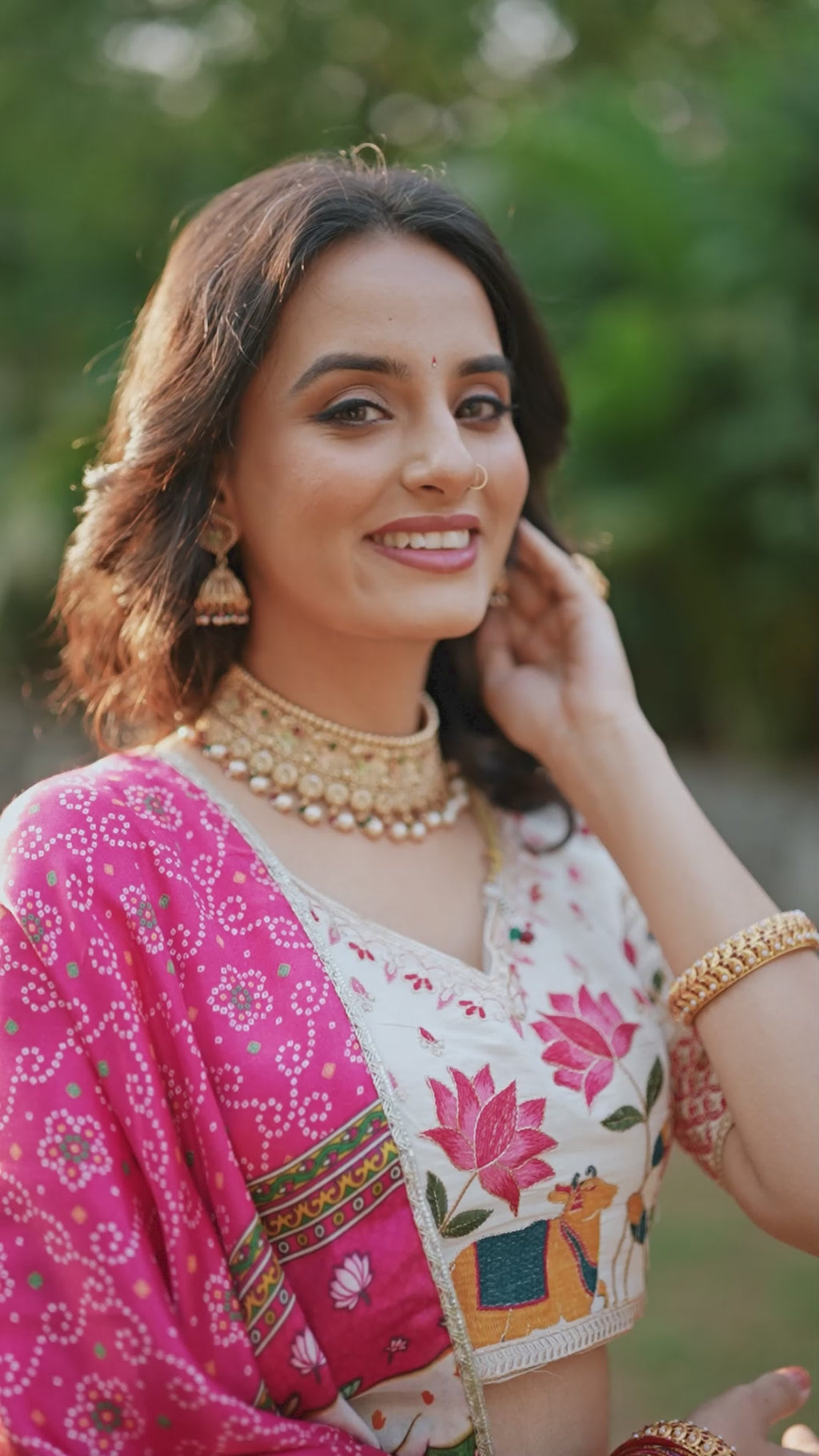 A vision of grace in an ivory lehenga adorned with peacock motifs.